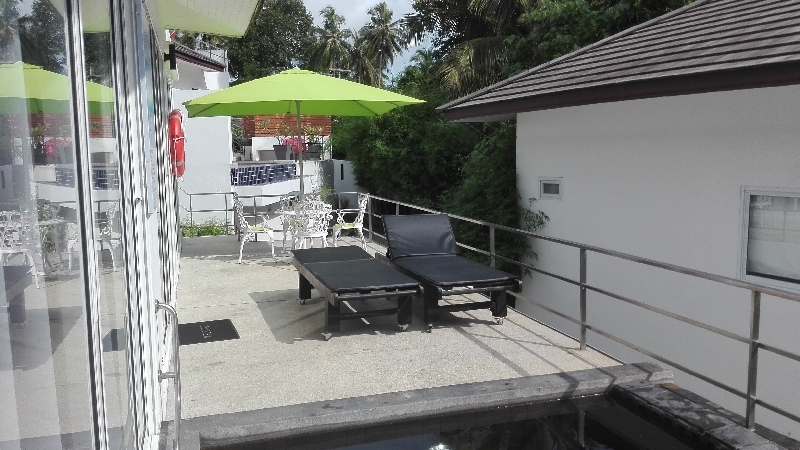 large parasol and second large swimming pool at 30 meters at the bottom of the photo